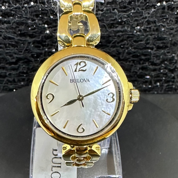 Women's (NWT) Bulova w/Mother-of Pearl Face, Gold Bezel, and Gold Chain Bracelet - Picture 1 of 5